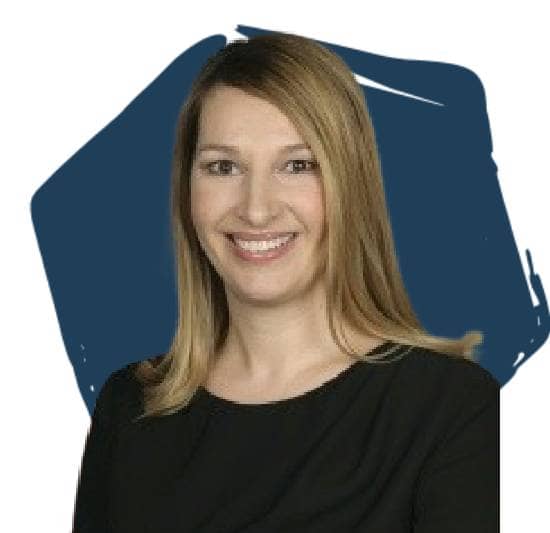 Heather Higginbottom, Board Director, in front of a blue hexagon.